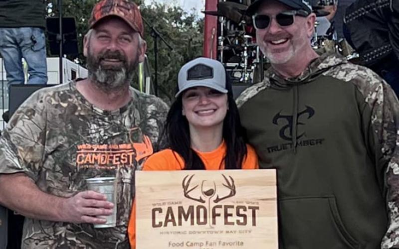 Contribute Photo 2024 Camofest Food Camp Fan Favorite Edward Jones Financial Advisor James Scardami, left is joined by Bay City Main Street Program Manager Tina Iseral, and Robert Knox.