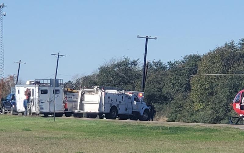 Sentinel Photo/MaLinda Reddell Emergency vehicles converge on the scene of a two-vehicle collision on Texas 35 and CR 442 near Blessing Wednesday, Dec. 27. Both of the drivers were taken by helicopter to Memorial Herman Hospital in Houston, DPS Sgt. Stephen Woodard said.