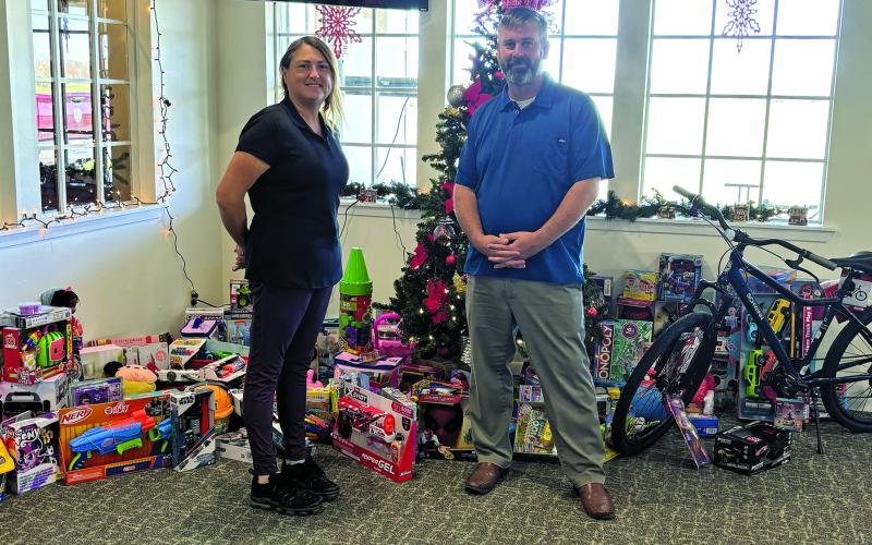 Contributed photo Rio Colorado Golf Course recently donated toys to Toys for Tots, with James Scardami accepting.