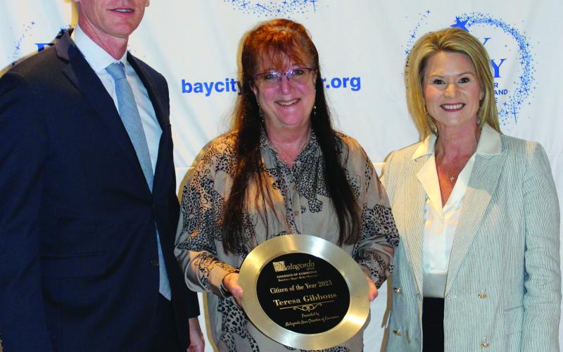Matagorda Chamber of Commerce Person of the Year for 2024 Teresa Gibbons (center) with Matt Gullett and Danyel Biggerstaff.