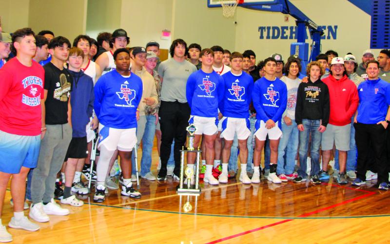 Sentinel Photo/Mike Reddell Tidehaven students, coaches, faculty and staff gathered for the presentation of the Chevy Spotlight Team of the Week trophy marking Tidehaven earning a spot in the state 3A-2 champsionship at AT&amp;T stadium. The gathering was at the Tigers’ basketball game with Palacios Friday, Jan. 19.