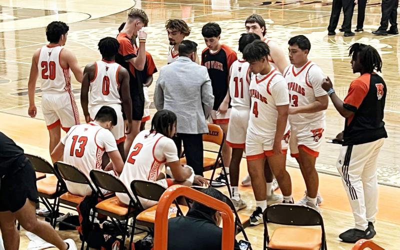 VVISD  photo  Coach Ramey, Coach Calk talk lead Van Vleck Leopards win 46-42 in overtime beating Hempstead on January 26.