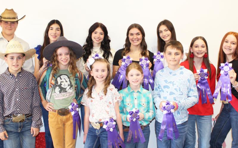 Sentinel Photo/Jessica Shepard Matagorda County Fair and Livestock Association's Home Economics food entry winners received purple rosettes for their win as Grand Champions of their chosen divisions Saturday, Feb. 24. Winners include Cole Baker, Truitt Foltyn, Drake O’Connoll, Kathryn Rodgers, Meredith Jones, Ruby Bonnot, Ryleigh Siptak, Ashley Alford, Aribella Carson, Barrett Botbyl, Jace Reynolds, Karoline Murray, Savannah Remmy, Kaitlyn Gilbert, Kaylee Spencer, and Ava Bowers.