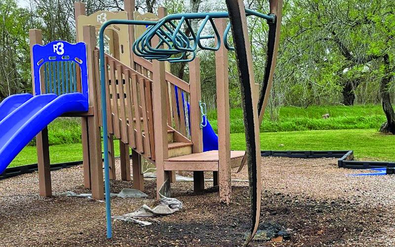 Fire Marshal’s photo shows damage to playground equipment and burn area at the park at 612 Duncan Ave. Playground damage from fire is suspicious in nature, said Fire Marshal. Photo/ Fire Marshal Dan Shook