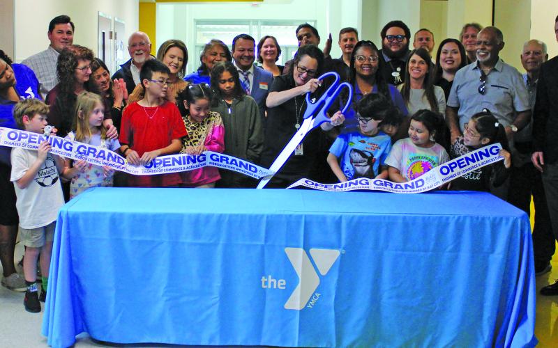 Sentinel Photo/Jessica Shepard The Bay City YMCA Program Center partnered with the Bay City Chamber of Commerce &amp; Agriculture to celebrate its grand opening with a ribbon-cutting ceremony, on March 11. Bay City YMCA currently has an after-school program located on Tenie Holmes, Linnie Roberts, and Cherry Elementary campuses.