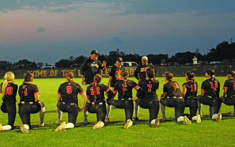 Photo by Anna Hernandez Lady Lep Head Coach Rebecca Hanson gives the girls a talk after the game with Danbury and lets them know they still have a lot of hard competition ahead of them for the playoffs.