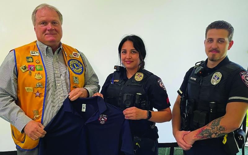 Dan Shook photo The Bay City Lion’s Club donated polo shirts to the Bay City Police Department patrol division. These shirts are for officers to dress uniformly when attending training sessions without wearing their patrol uniforms.