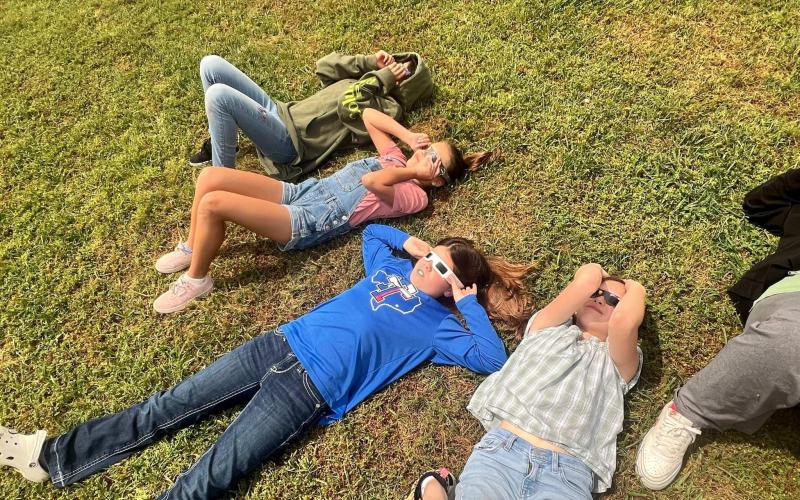 Contributed photo Markham Elementary students eclipse gazing Monday.