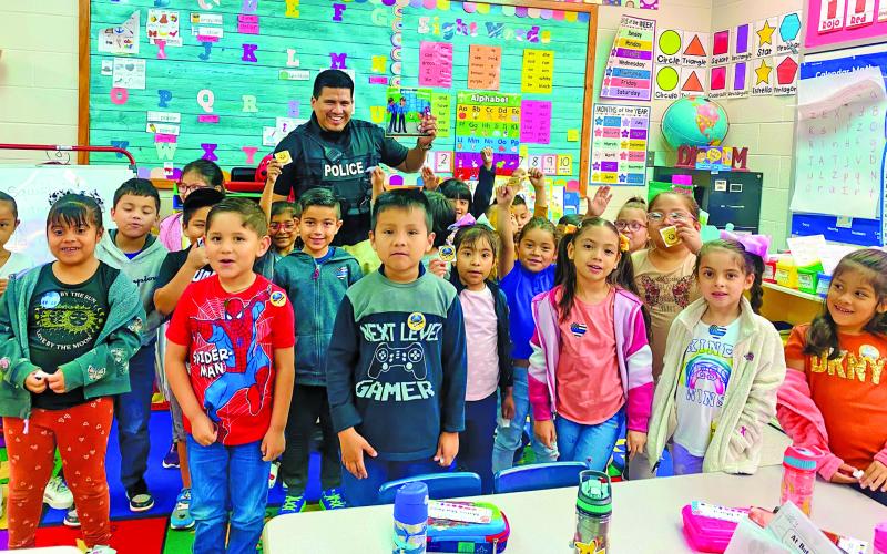 BCISD photo Bay City Police Officer A. Lopez read to Mr. DeLaRosa and Ms. Munoz's kindergarten classes at Cherry Elementary.