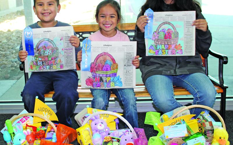Sentinel Photo/Jessica Shepard This year's Sentinel Easter Coloring Contest winners are Anthony Palomares, Maggie Dean, and Jade Velazquez. Each winner received a blue ribbon for their artistry and an Easter basket full of treats.