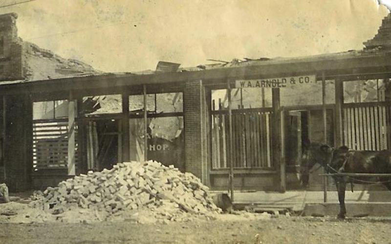 Courtesy of Matagorda County Museum Destruction of W. A. Arnold  &amp; Co. Meat Market and adjacent barber shop on the north side of the square. In 1906, they advertised "The Best Meats by Phone - just call number 48."