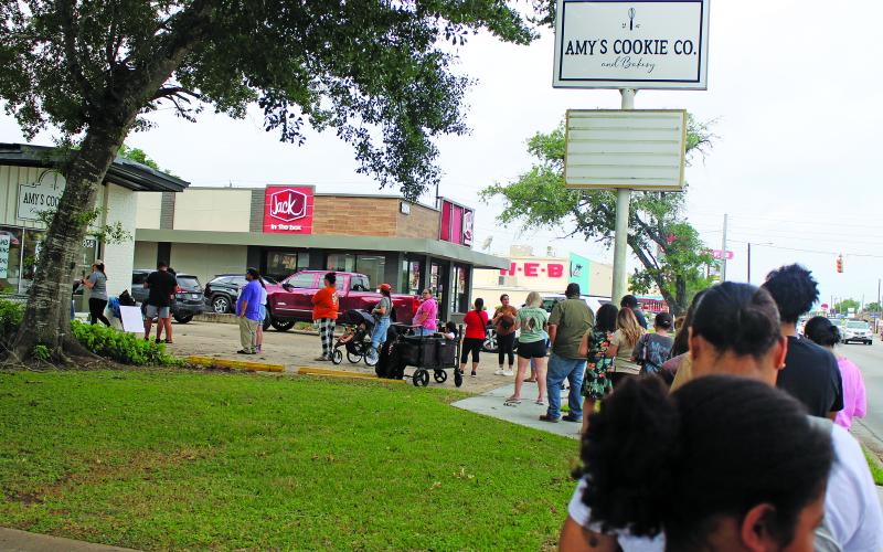 Sentinel Photo/Jessica Shepard The line for Amy's Cookie Co. and Bakery's grand opening stretched down the block on May 2. The bakery is located at 2808 7th St. in Bay City.