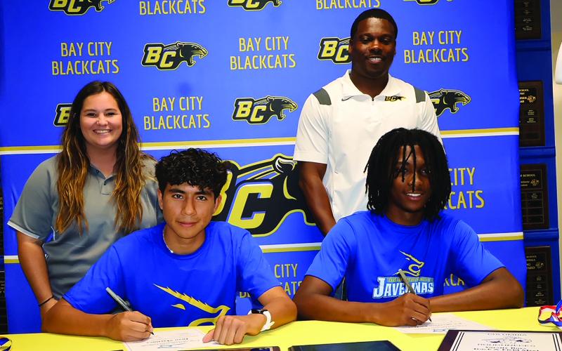 Monday, May 13, was signing day for Bay City High School student athletes Juan Martinez and Ke’Maurion Le’Day who signed the commitments with Cross Country Coach Rilea Sanders and Head Track Coach Robert Jones looking on. Both boys are continuing their education and athletic careers at Texas A&amp;M Kingsville. Martinez will be running cross country and track, while Le’Day will be running track. LeDarion Stone/Live in the Moment Photography