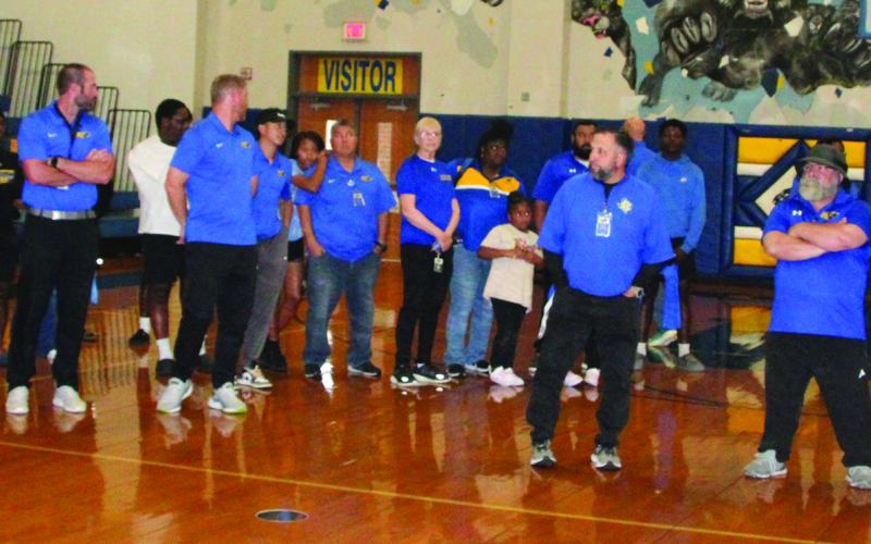 Sentinel Photo/Mike Reddell Newly named BCISD Athletic Director Robert Jones (far right in photo) is joined by BCISD Superintendent Dwight McHazlett at a May 23 reception welcoming Jones as Head Football Coach and Athletic Director.