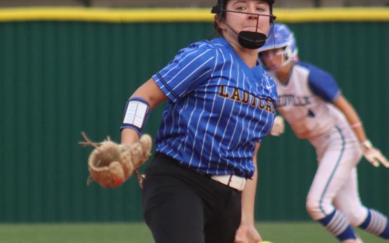 The Ladycats’ pitcher prepares to deliver in the Game 1 at the Bay City Girls’ 1st Round Playoff Series Vs Needville In Wharton April 26. The Ladycats lost 10-0. LeDarion Stone /Live in the Moment Photography