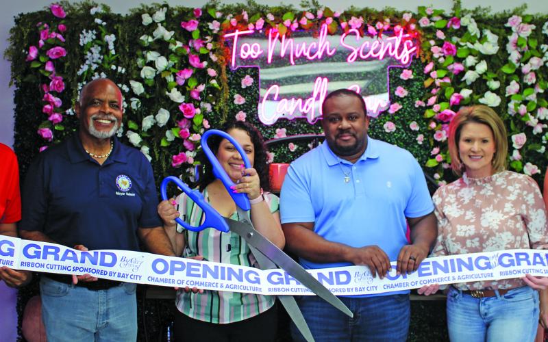 Sentinel Photo/Jessica Shepard Too Much Scents partnered with the Bay City Chamber of Commerce &amp; Agriculture for an open house ribbon-cutting ceremony on May 10. The candle bar is located at 2807 7th St. in Bay City.
