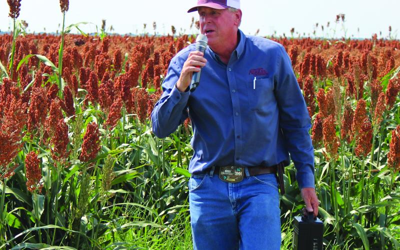Sentinel Photo/Jessica Shepard Matagorda County Agriculture and Natural Resources Extension Agent Greg Baker identified several crop rows as sorghum grain trial crops near FM 521 to “Matagorda County Row Crop Tour” attendees last Thursday. Baker also took the group to corn and cotton crops in the El Maton area.