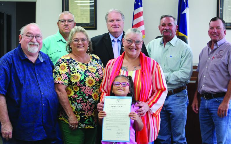 Matagorda County Commissioners Court unanimously approved a proclamation designating June as "Myasthenia Gravis Awareness Month" Monday morning, June 3. Joining the commissioners were, from left: Simon DeSoto, Laurie Weathers, Andrea Savage, and Rylee Savage. Sentinel Photo/ Jessica Shepard