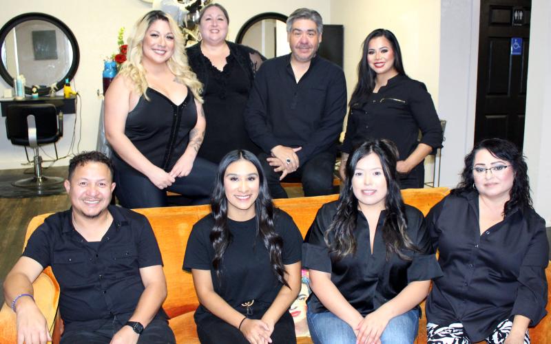 Sentinel Photo/Jessica Shepard Salon &amp; Spa owner Nicasio Perez, center back, celebrated his business' 10th anniversary on Friday, June 7. The salon is located at 2905 Ave. F in Bay City.
