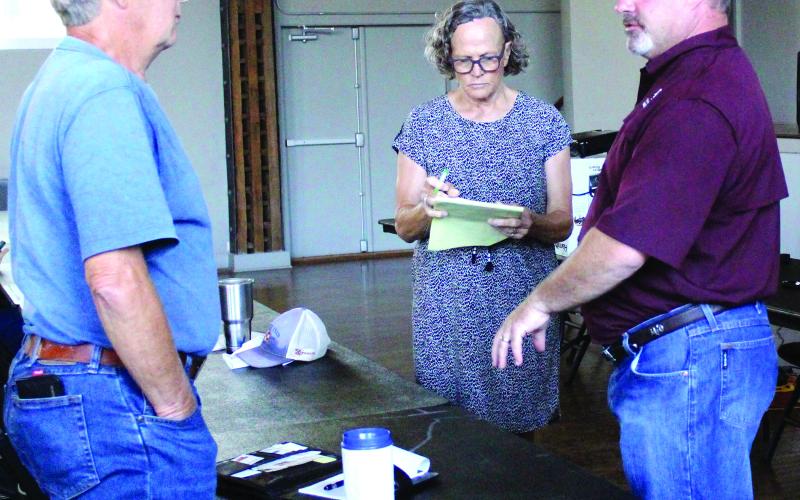 Sentinel Photo/Jessica Shepard Corpus Christi Texas A&amp;M AgriLife Extension Livestock Specialist Dr. Karl Harborth, left, addresses concerned ranchers at the Matagorda County Soil &amp; Water Conservation District’s (SWCD) workshop on June 7.