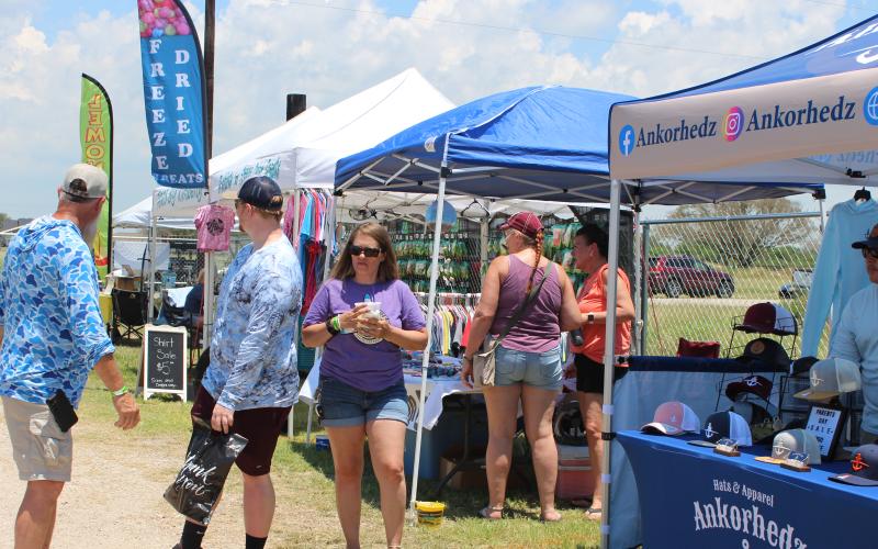 Sentinel Photo/Jessica Shepard The 5th Annual Matagorda Surf &amp; Turf Festival featured vendors peddling everything from food and custom tumblers to T-shirts and resin decor last Saturday. Proceeds from the event are earmarked for Matagorda beach and bay beautification and conservation projects.