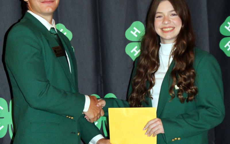 Sentinel Photo/Jessica Shepard The coveted Gold Star award was given to Slade Saha, above, who celebrated his success with 4-H Ambassador Scollie Saha, right. Not pictured is award recipient Leeland Chandler.