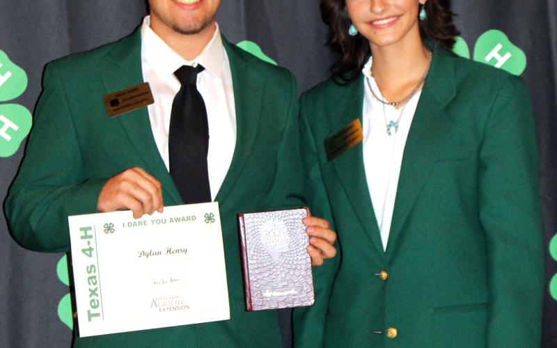 Sentinel Photo/Jessica Shepard The “I Dare You” and “Ag Production” awards were given to Dylan Henry, left, and 4-H Ambassador Kaitlyn Gilbert celebrated his success.