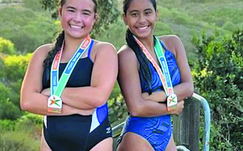 Contributed photo Aquacats Lilly Wurtz and Kailey Rodriguez teamed up with swimmers from Rosenberg and Kerrville to compete in the 200 yard medley relay and brought home bronze at Nationals in San Diego.