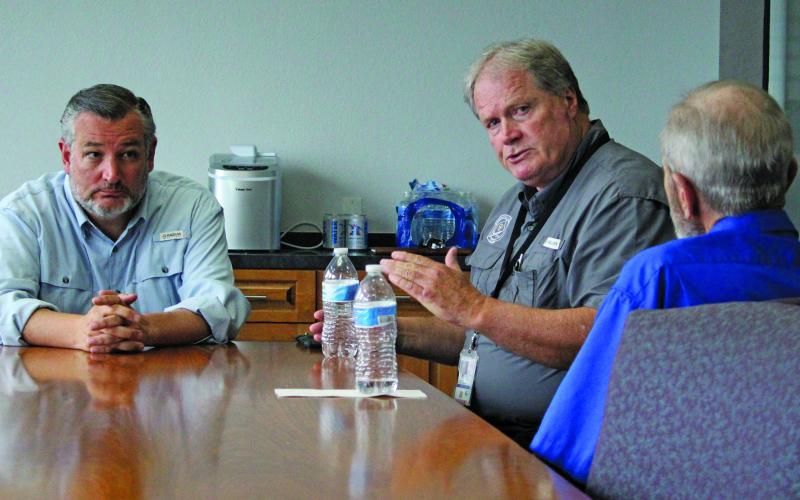 Sentinel Photo/Jessica Shepard U.S. Senator Ted Cruz, left, visited with city and county officials about Hurricane Beryl’s destruction Monday afternoon.