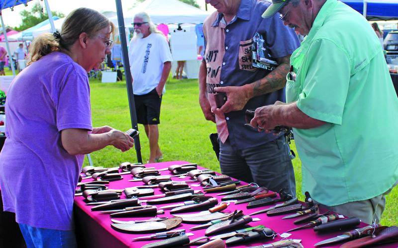 Sentinel Photo/MaLinda Reddell Matagorda Historical Society hosted Christmas In July in Heritage Park last Saturday. The society raises funds to keep history alive in Matagorda. Society members will work on fixing a local structure for a new home for the Texas Navy.