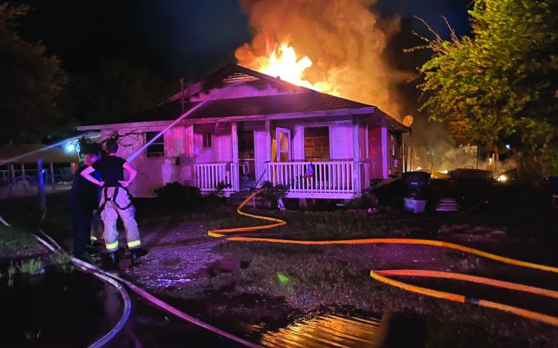 Contributed photo Firefighters battle a blaze at a Palacios residence July 1.
