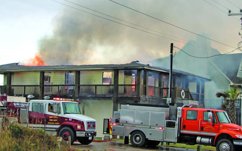 Sentinel Photo/Mike Reddell Several Matagorda County volunteer fire departments rushed to help Sargent VFD in battling a house fire at the 900 block of Canal Thursday morning, July 11. Assisting were Bay City VFD, Van Vleck VFD, Wadsworth VFD, and Matagorda VFD.