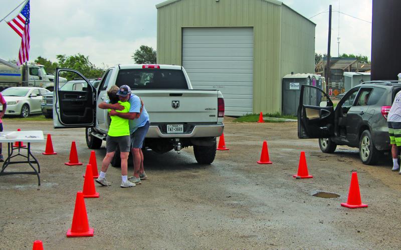 Sentinel Photo/Mike Reddell Sargent volunteers worked in many ways to ease plight of residents, such providing food, water and assistance.