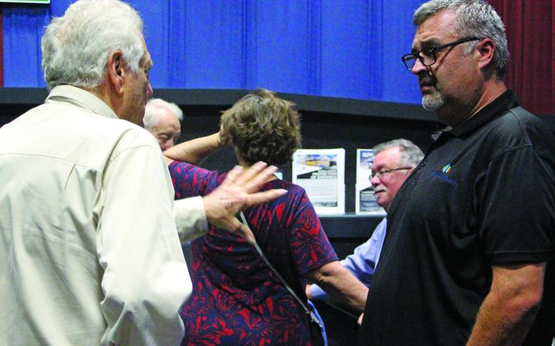 Sentinel Photo/Jessica Shepard Lynn Engineering owner Stuart Lynn, left, talks with an audience member after his luncheon presentation on Aug. 20. The lunch was sponsored by the Bay City Community Development Corporation and featured Lynn’s five tools for successful business growth as the topic.