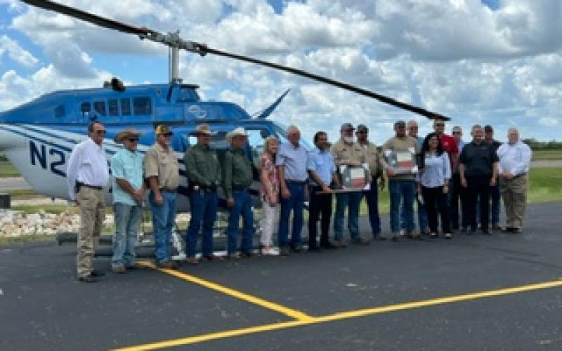 Two AEP crewmen and a Westwind helicopter pilot were honored for helping save a Blessing area man who the crew saw lying in a pool of blood on his property after Hurricane Beryl landed. The crewmen, Ronald “Cole” Overcash and Joel Hilburn, saw Edward Gurecky on his driveway, and pilot Marcus Perez immediately landed the helicopter and acted quickly to help Gurecky. The two crewmen and pilot were honored at a ceremony at Bay City Regional Airport Wednesday, Sept. 18.   Renee Chollett photo