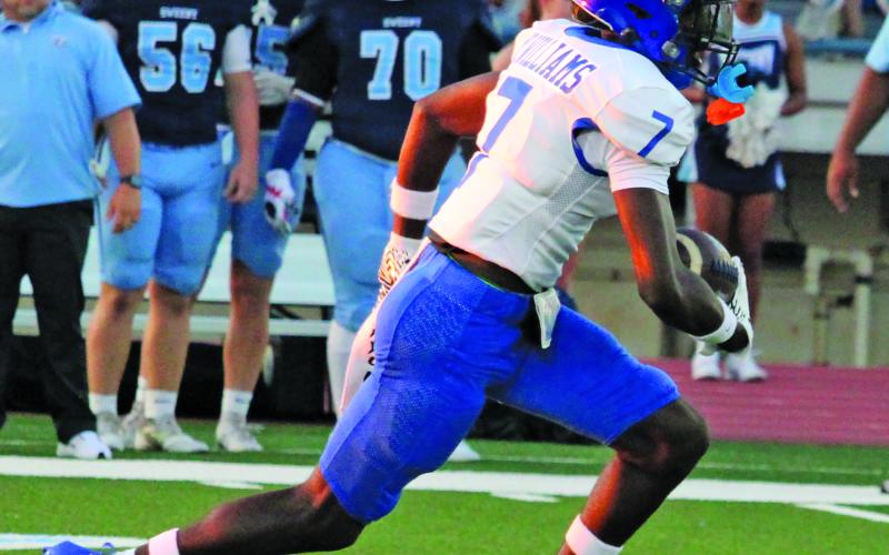 Sentinel Photo/Mike Reddell Bay City senior wide receiver Xylan Williams (7) takes off on 70-yard punt return for a touchdown in the first quarter