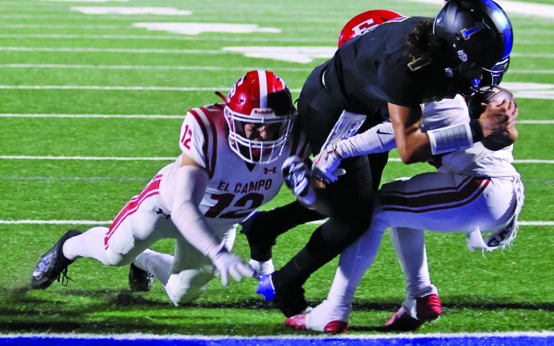 LeDarion Stone/Live in the Moment Photography Bay City’s senior quarterback Alex Estrada plunges ahead for a touchdown against El Campo Friday at Memorial Stadium.