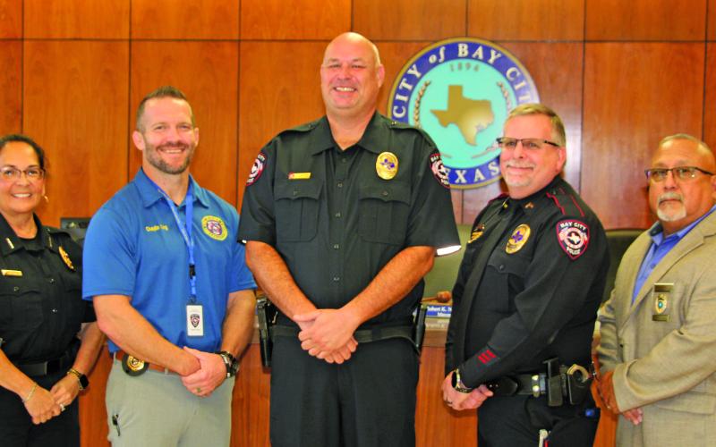 Sentinel Photo/Mike Reddell Police Chief Christella Rodriguez, far left, announced promotions of four officers, from left: James King, Stephen Lunsford, Robert Pierce, and Richard Morales.
