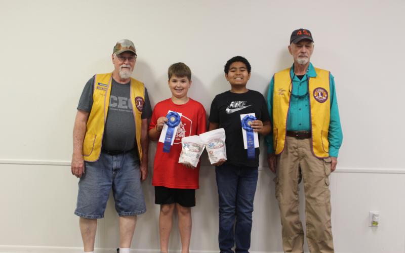 Sentinel Photo/Jessica Shepard Lion Tim Hall with "Rice Dish Roundup" winners in grades 6-8 were Reese Busby, Kysen Woods, and Lion Wayne Witte. Austin Machacek is not pictured.