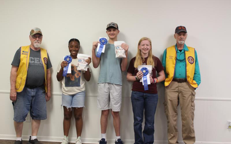 Sentinel Photo/Jessica Shepard Lion Tim Hall with High school grade "Rice Dish Roundup" winners include Trinitee Strother, Joseph Machacek, Lily Chandler, and Lion Wayne Witte. Kenadie Bell (not pictured).