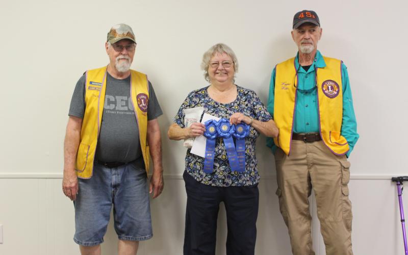 Sentinel Photo/Jessica Shepard Lion Tim Hall with adult winners Kathy Jackson and Lion Wayne Witte. Adult winner Patty Frankson is not pictured.