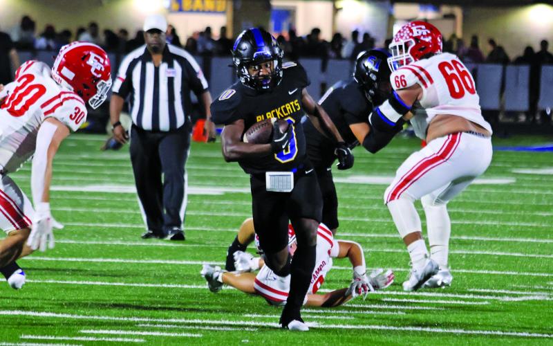LeDarion Stone/Live in the Moment Photography Bay City’s Jada Andrews (0) picks up yardage against El Campo Friday, including a 60-yard touchdown pass play.