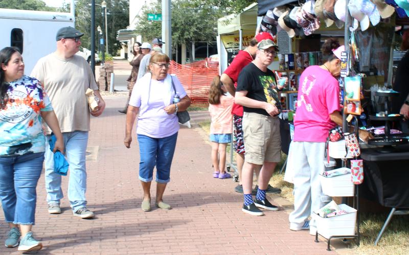 Sentinel Photo/Jessica Shepard Vendors lined the Matagorda County Courthouse offering a variety of wares Saturday, Oct. 26. Among holiday decor, children's toys and various food stalls were several apparel vendors like above.