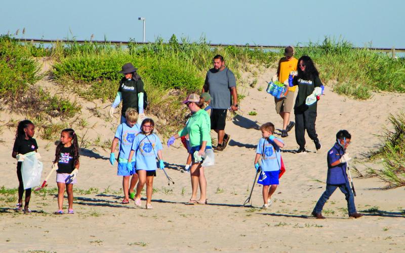 Sentinel Photo/Mike Reddell Volunteers spread out for the Adopt-A-Beach at Matagorda Beach Saturday, Sept. 28.