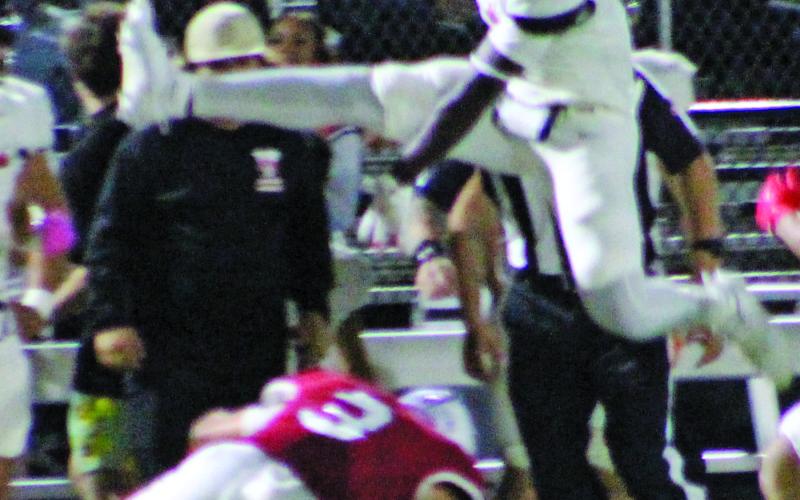 Sentinel Photo/Jessica Shepard Van Vleck running back Corey Austin, above, leaps over a Tidehaven defender.