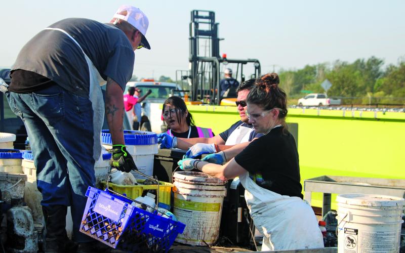 Sentinel Photo/Mike Reddell Workers with Clean Harbor - the waste disposal company the county contracts for the Household Hazardous Waste Collection event  - unloads various chemicals at the collection site at the Matagorda County Fairgrounds Saturday, Oct. 12.