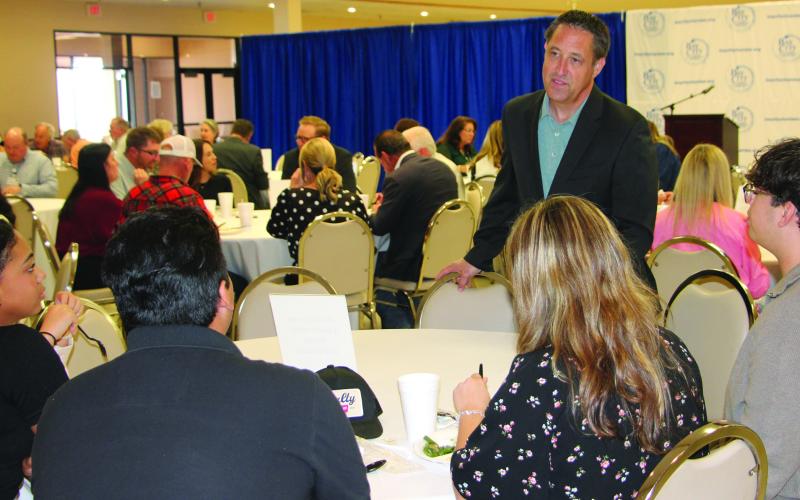 Sentinel Photo/Jessica Shepard Texas Comptroller Glen Hegar visits with Matagorda County Youth Leadership Class members prior to his chamber luncheon talk last week.