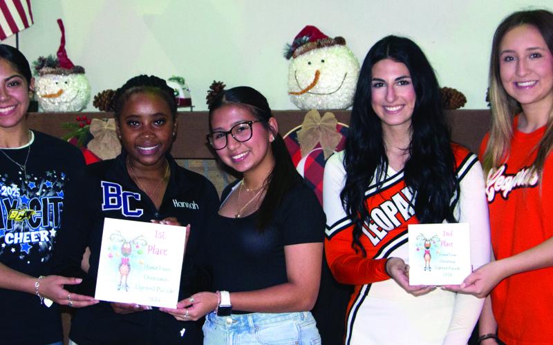 Bay City Sentinel Photo/Jessica Shepard School-based cheer and dance group awards went to Bay City High School and Van Vleck High School cheerleaders for first and second place respectively. Not pictured are third-place winners from Bay City Junior High School.