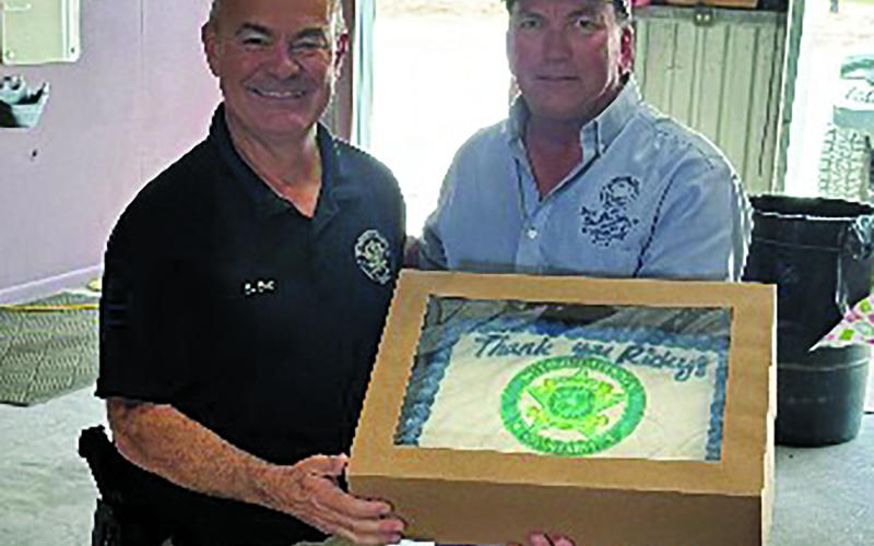 Precinct 2 staff had a special presentation for Precinct 2 Constable Ricky Bort at the precinct's Christmas recent lunch, recognizing Bort's help to the precinct. Shown are Bort, left, with Precinct 2 Commissioner Mike Estlinbaum Contributed photo