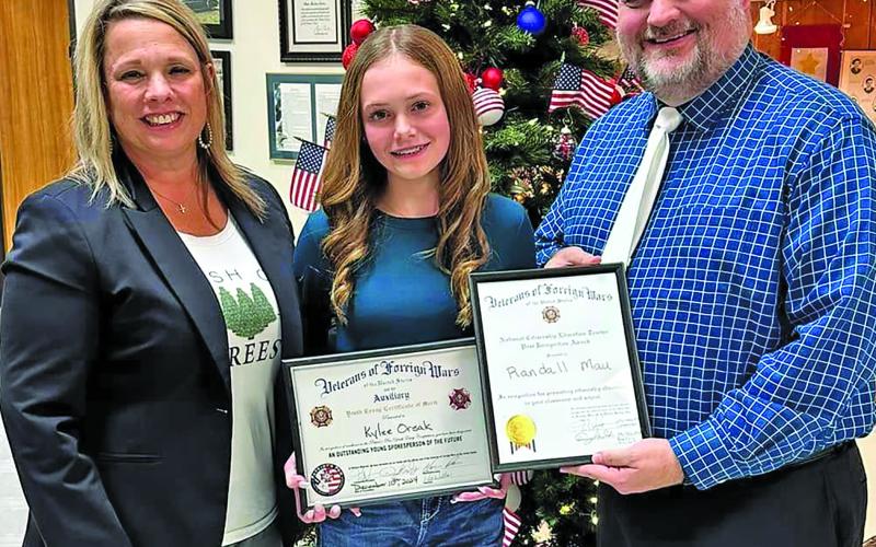 VVISD Photo The VFW Post 2438 of Matagorda County recognized Randall “Randy” Mau of Van Vleck High School as Teacher Of The Year and Van Vleck Junior High 8th grade student, Kylee Orsak, for her excellence in The Patriot’s Pen Youth Essay Competition. From left,VVISD Superintendent, Christie Dement - VVJH Student, Kylee Orsak - VVHS Teacher, Randall “Randy” Mau at the VFW Award Ceremony.